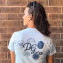 back of person wearing Dancing Goats light blue boxy fit cropped tee