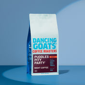 Dancing Goats Coffee Roasters packaging on a blue background