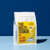 Coffee bag labeled 'The Multitasker by Alton Brown' on a blue background