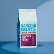 Dancing Goats Coffee Roasters packaging on a blue background