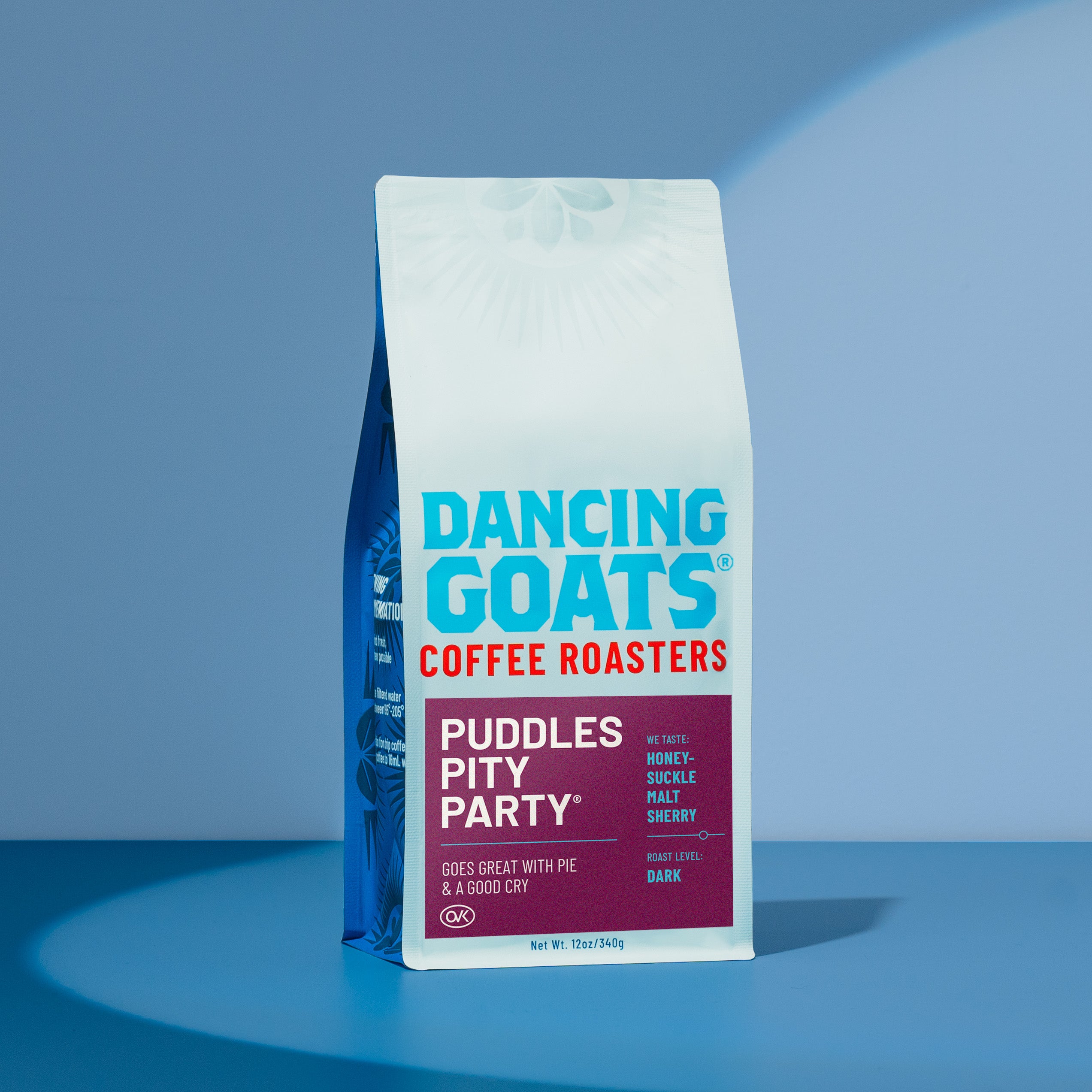 Dancing Goats Coffee Roasters packaging on a blue background