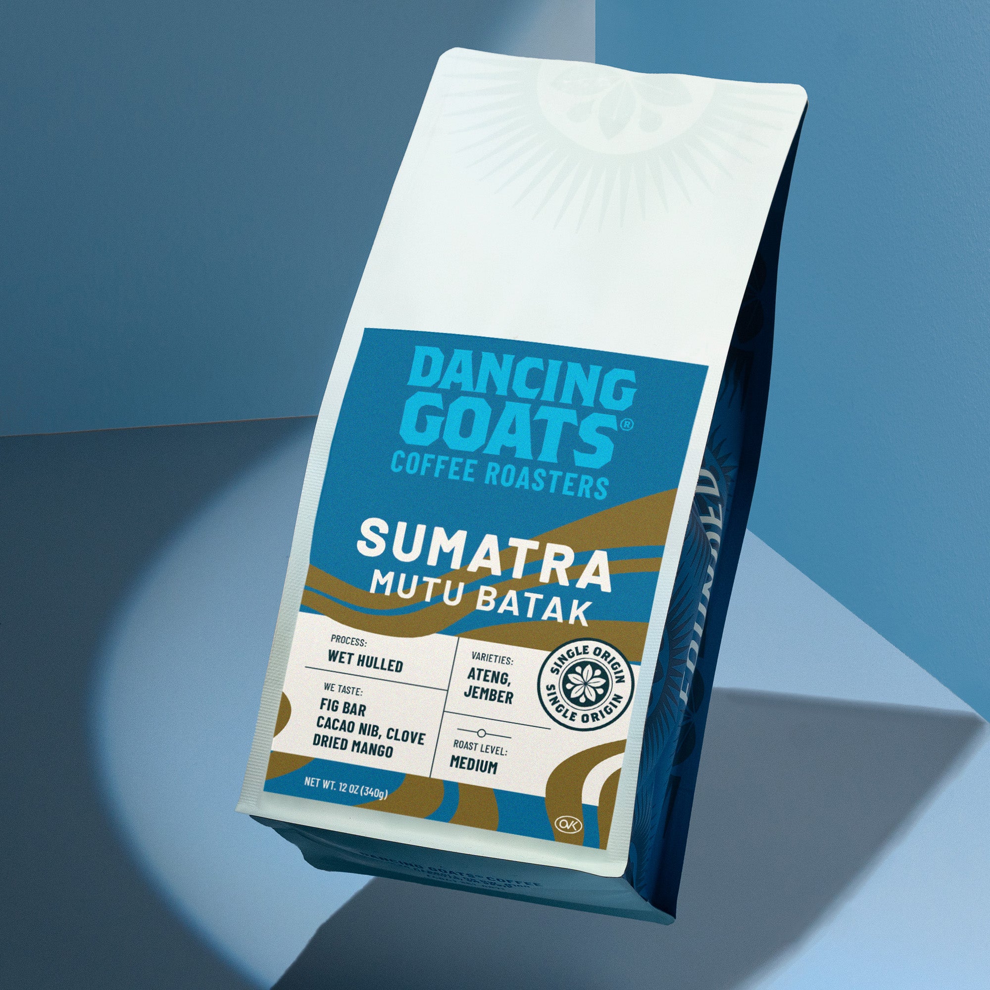 Dancing Goats Coffee Roasters Sumatra Mutu Batak coffee bag on a blue gradient background