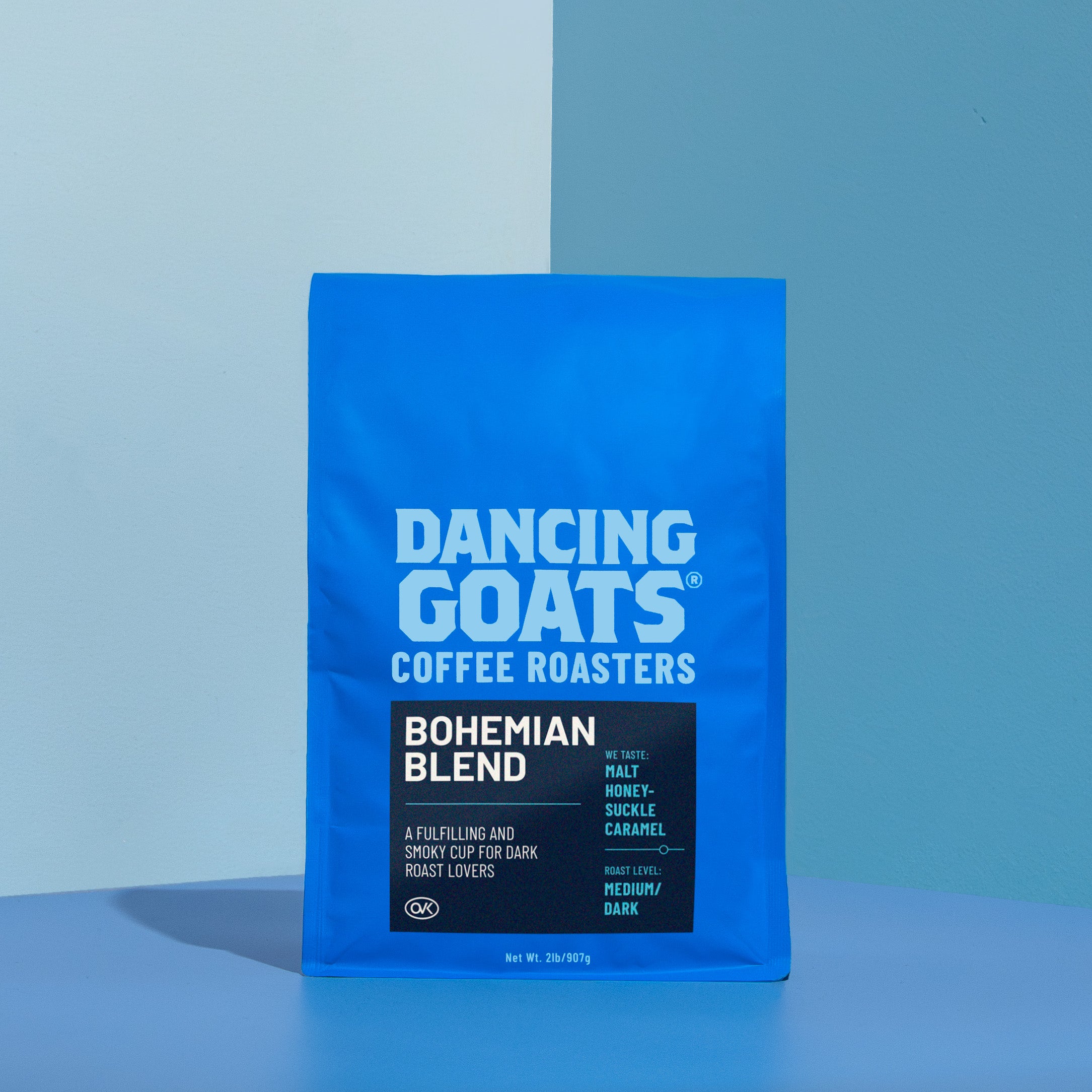 Blue package of Dancing Goats Coffee Roasters Bohemian Blend on a blue background