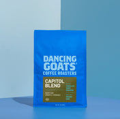 Blue bag of Dancing Goats Coffee Roasters Capitol Blend on a blue background