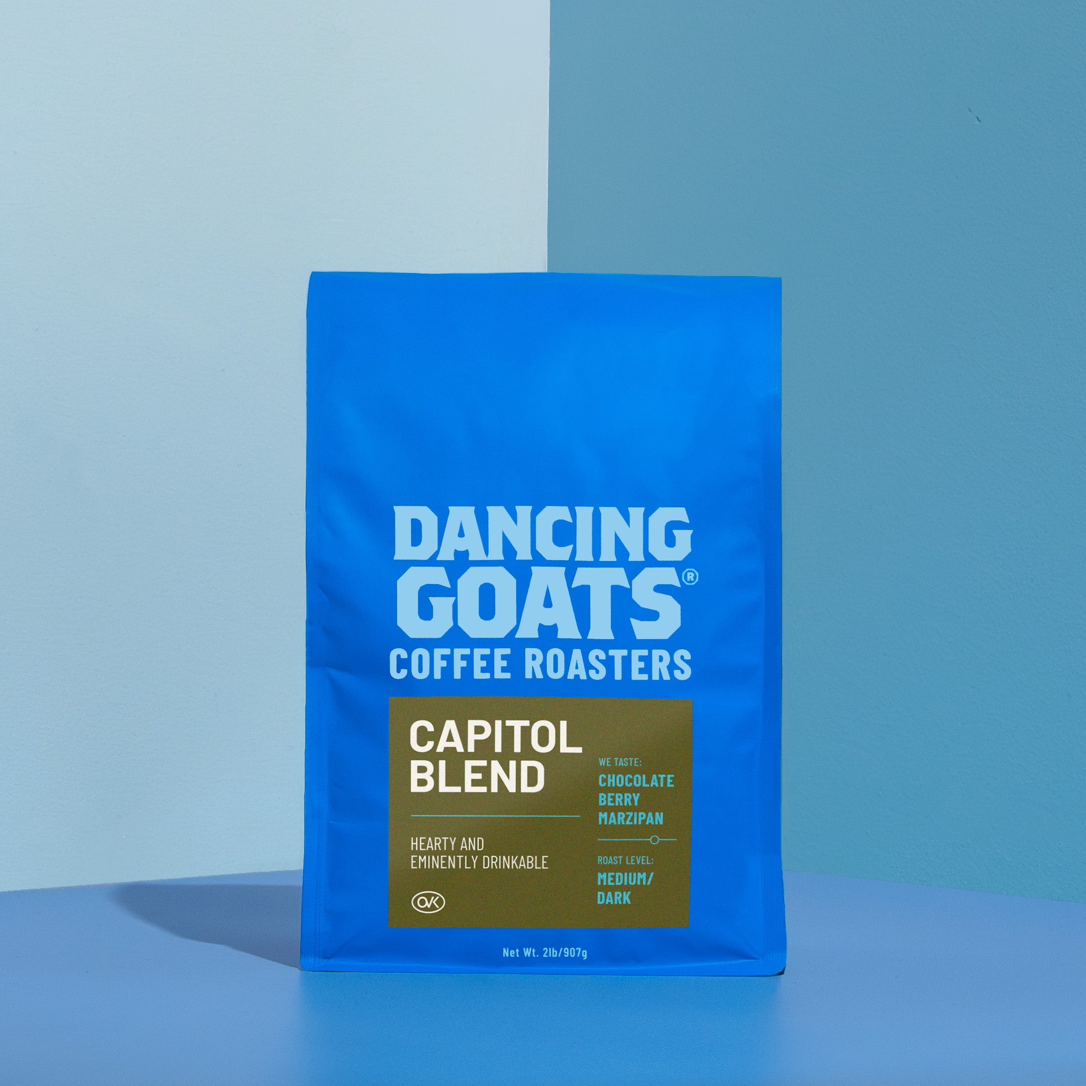 Blue bag of Dancing Goats Coffee Roasters Capitol Blend on a blue background