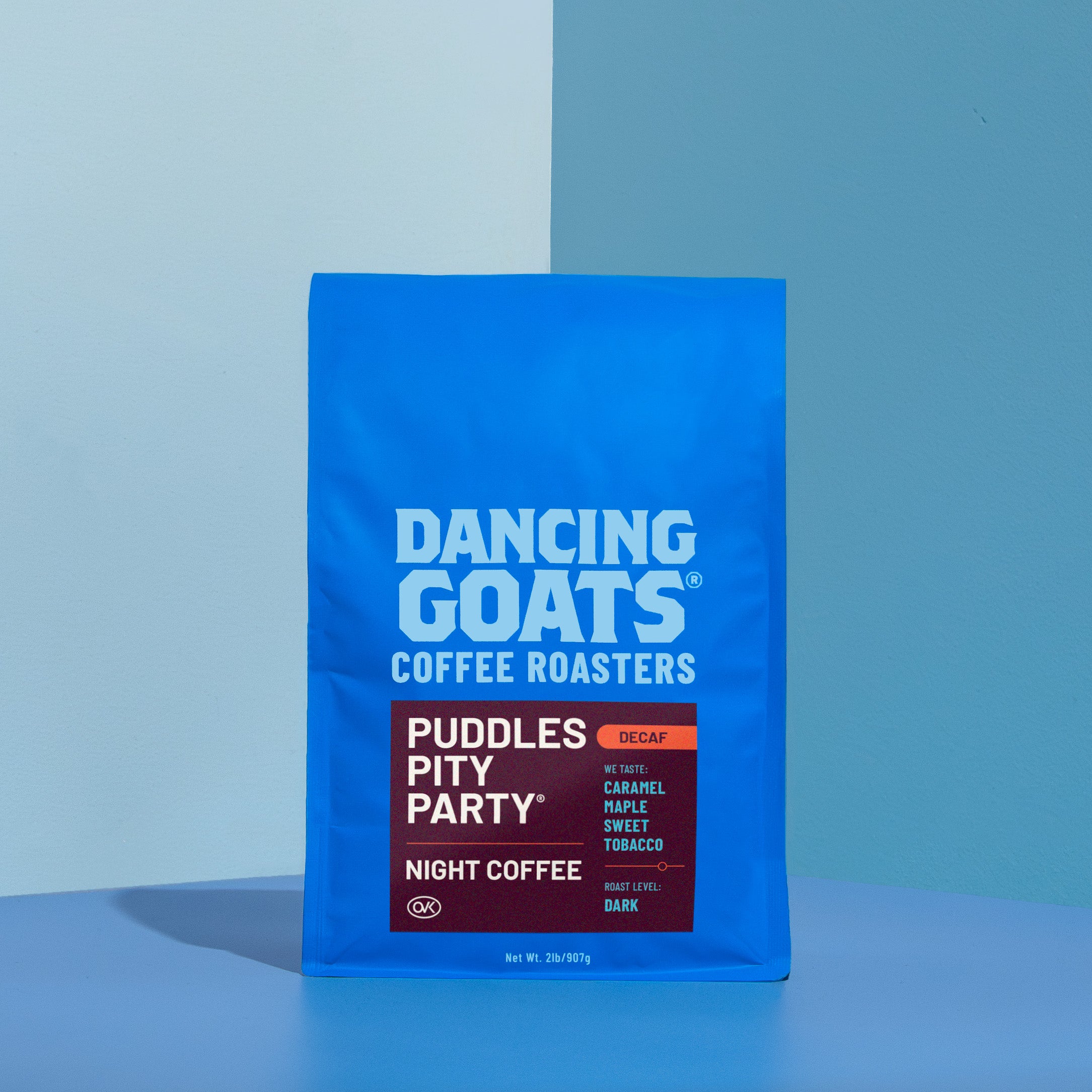 Blue package of Dancing Goats Coffee Roasters on a blue background