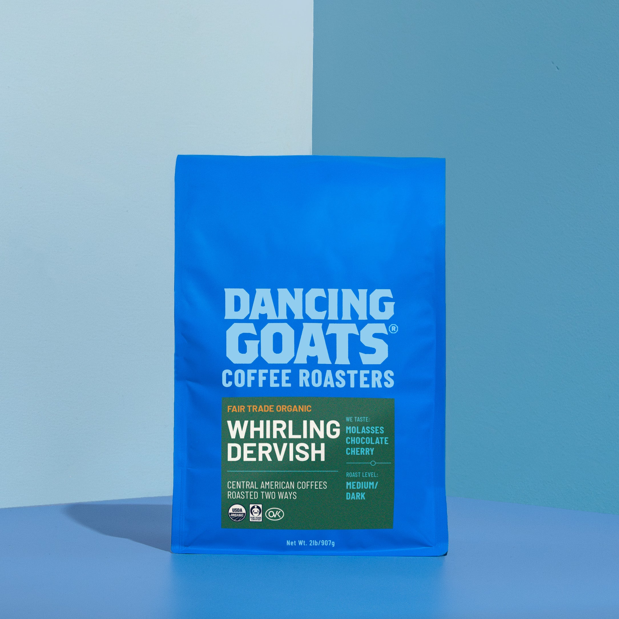 Blue bag of Dancing Goats Coffee Roasters Whirling Dervish coffee on a blue background