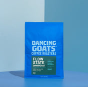 Blue package of Dancing Goats Coffee Roasters on a blue background