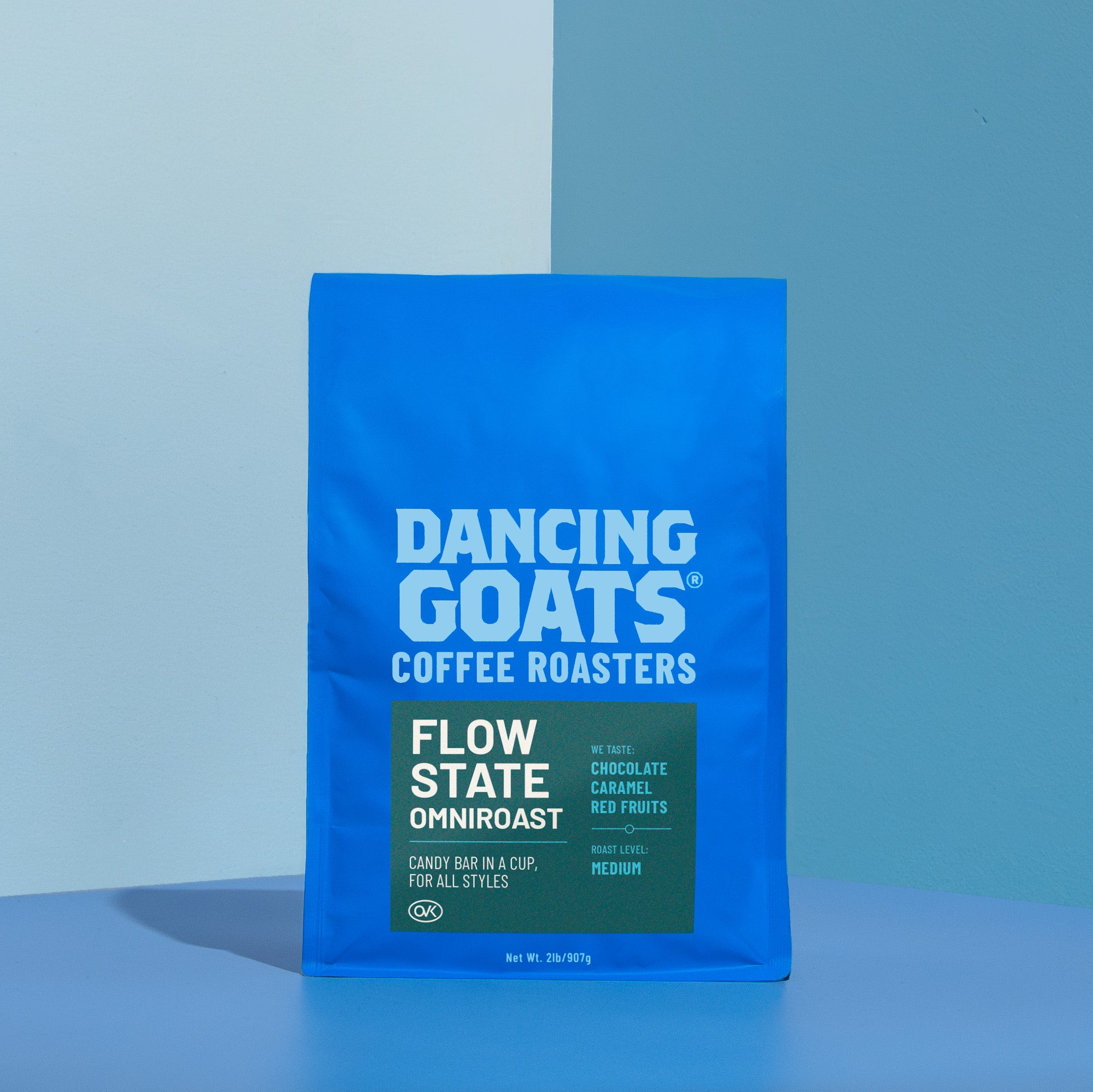 Blue package of Dancing Goats Coffee Roasters on a blue background