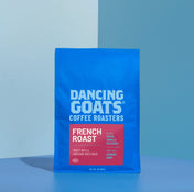 Blue package of Dancing Goats Coffee Roasters French Roast on a blue background