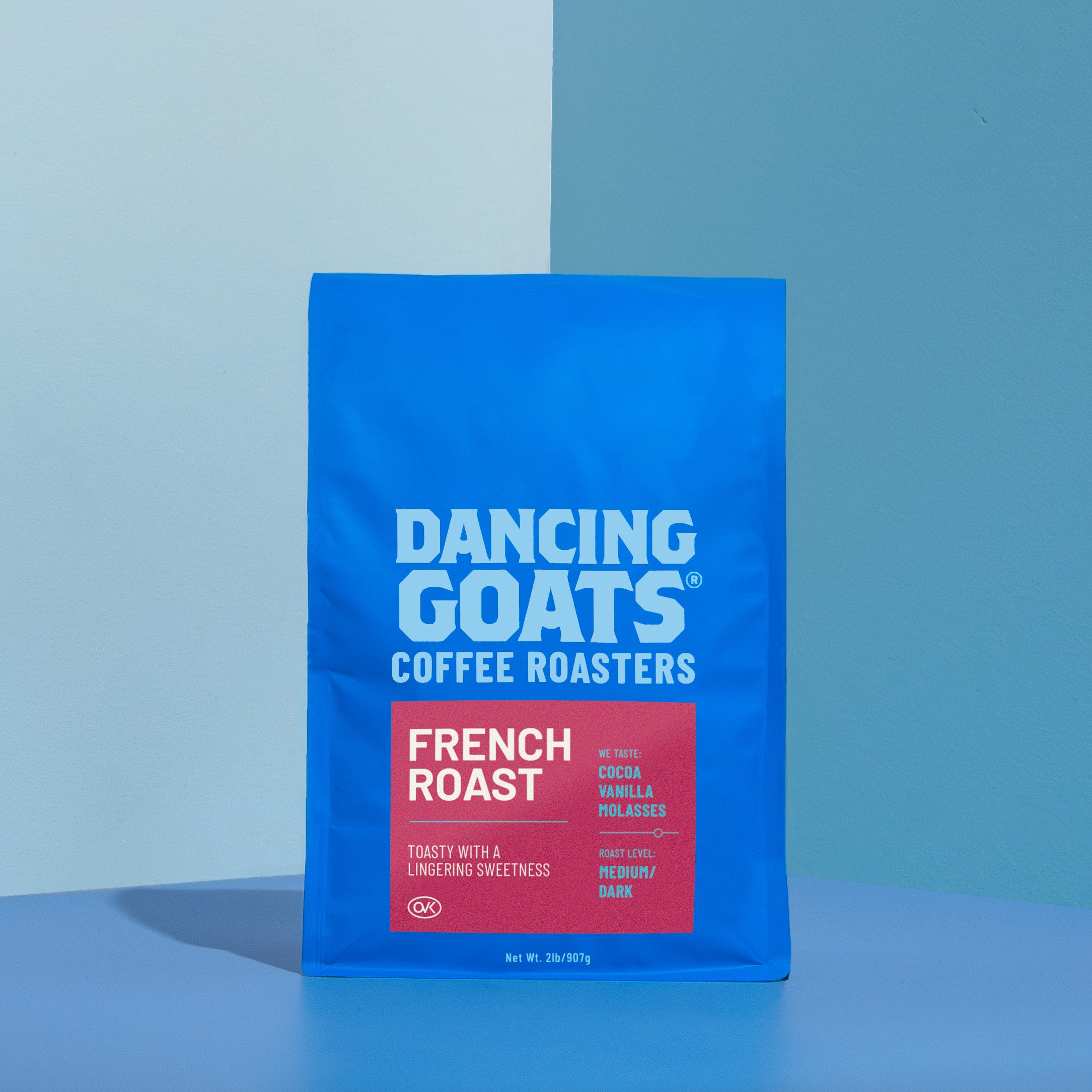 Blue package of Dancing Goats Coffee Roasters French Roast on a blue background