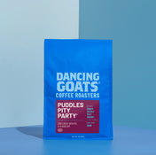 Blue bag of Dancing Goats Coffee Roasters on a blue background