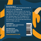 Back of a beverage can or bottle package showing nutrition facts, ingredients, and a barcode over a dark blue background with orange abstract shapes. Visible text includes Dancing Goats Coffee and dancinggoats.