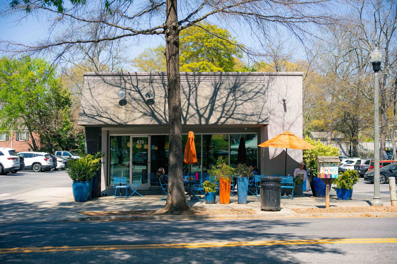 Front of Decatur cafe with outdoor seating area on a sunny day