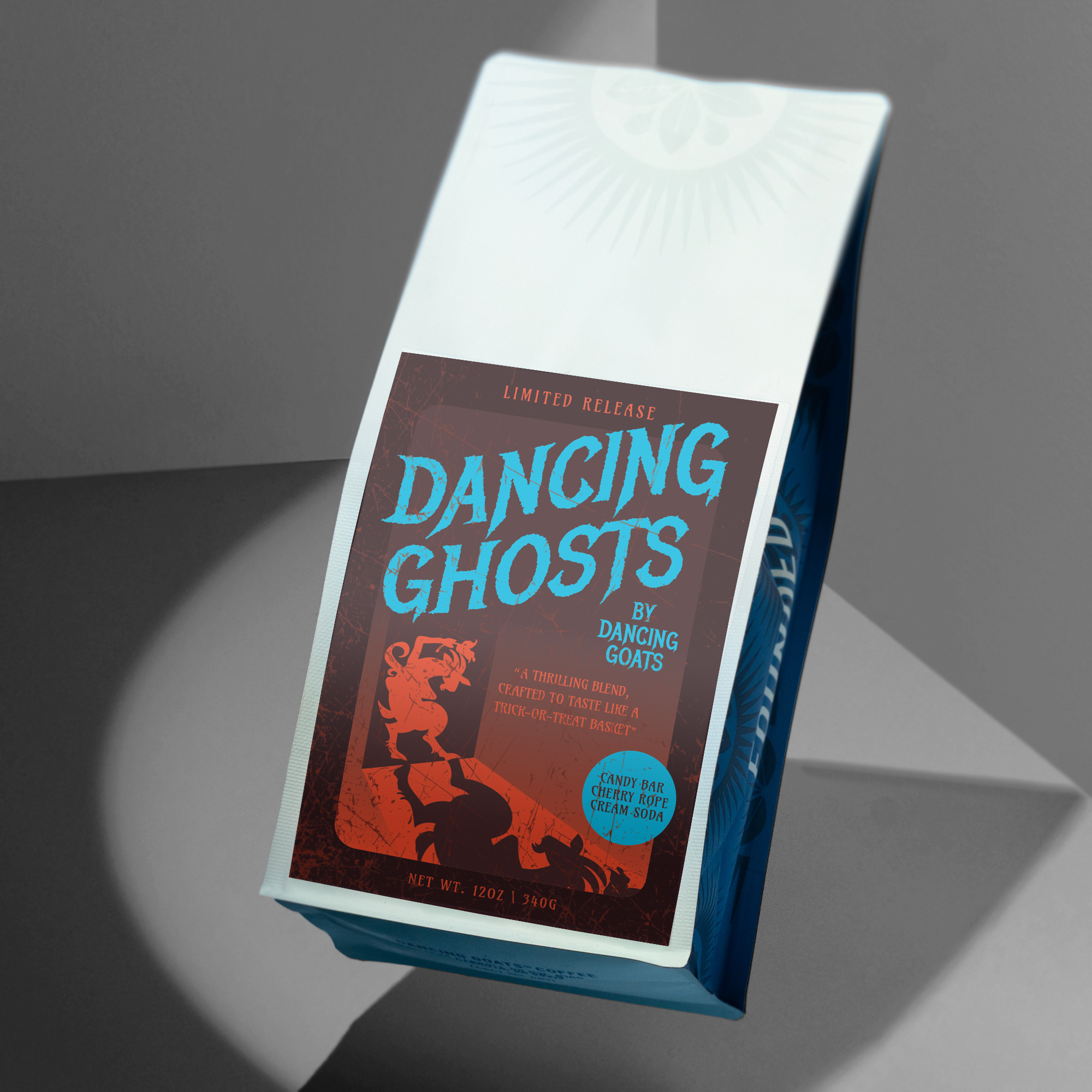 blue coffee bag with red label: Dancing Ghosts by Dancing Goats