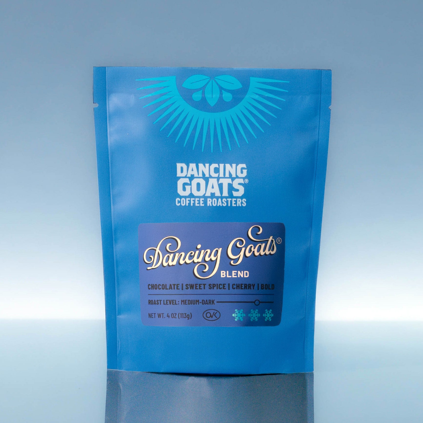 Blue package of Dancing Goats Coffee Roasters on a gradient background