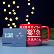 image of dancing goats gift card leaning on red mug