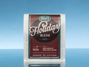 Dancing Goats Coffee Roasters Holiday Blend 2025 coffee package on a blue background