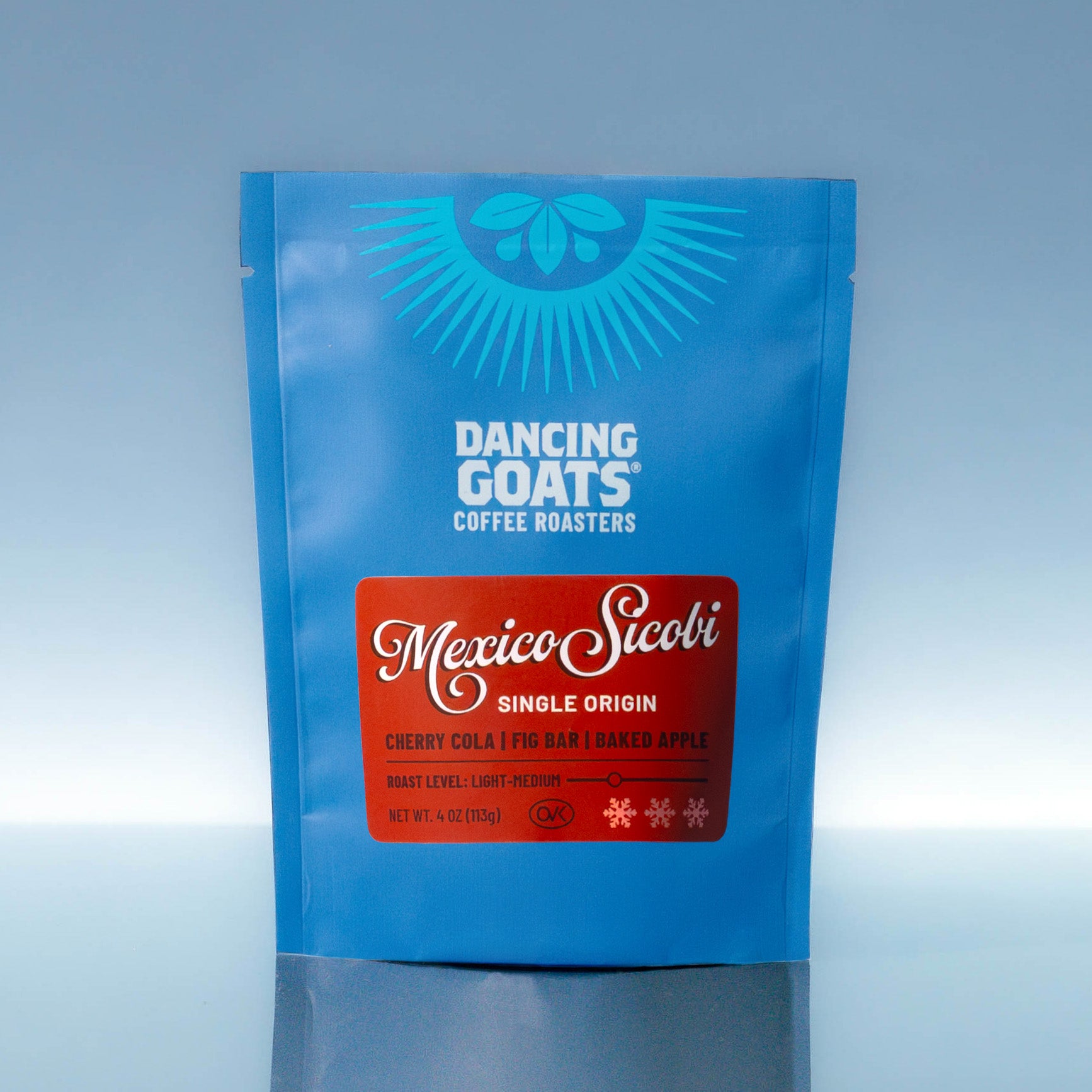 Blue coffee bag with 'Dancing Goats Coffee Roasters' and 'Mexico Sicoli' label on a light blue background