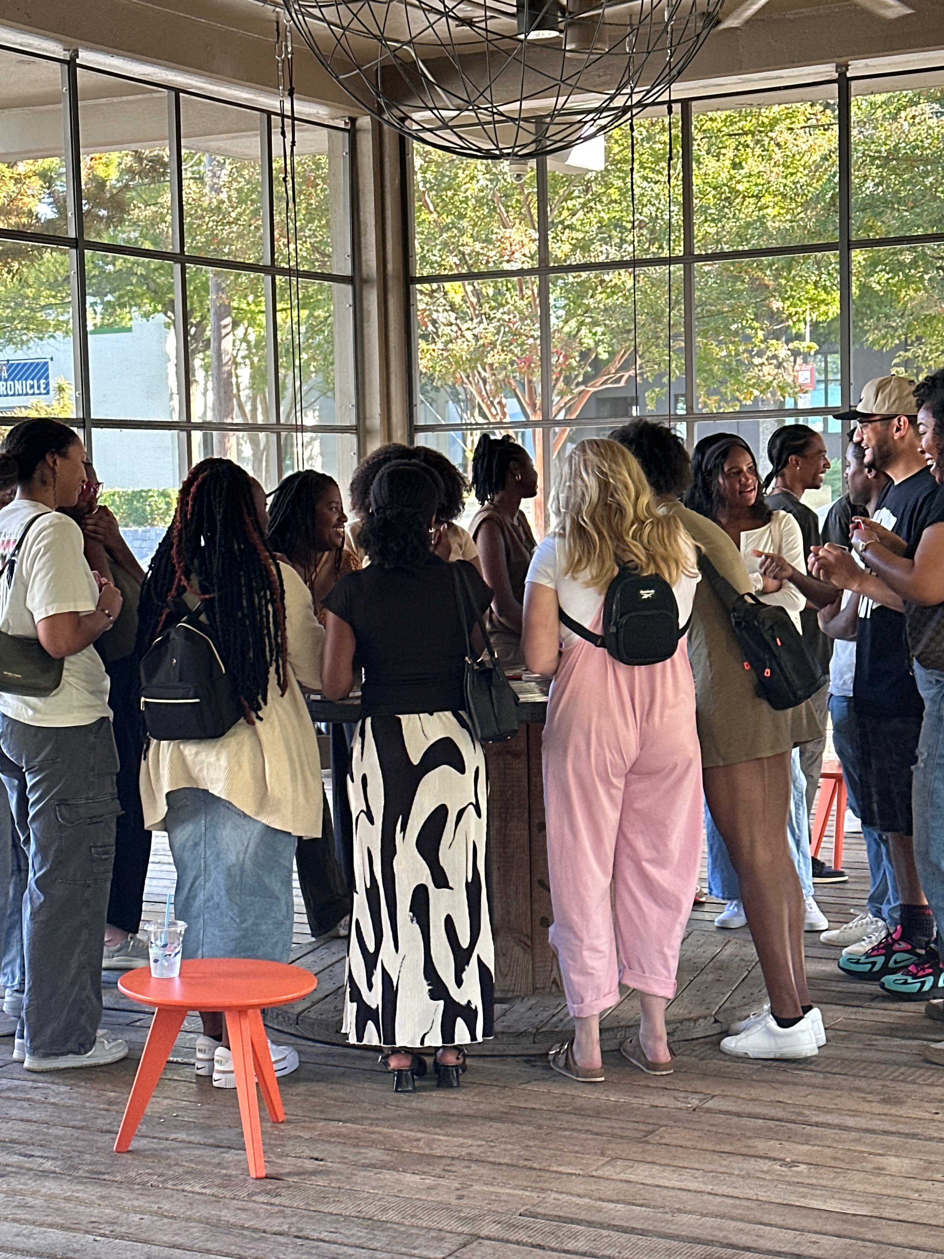 Group of people standing and taking on the Ponce City Market patio