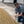 Man inspecting roasted coffee beans outdoors